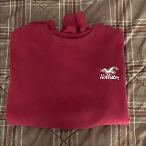 Maroon cropped Hollister sweatshirt.